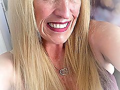 Real older whore is revealing her breasts