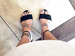 A well-endowed older woman is pleasuring herself