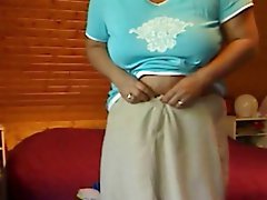 Fiery older woman is fingering her holes