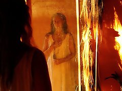 An amazing old lady is posing almost naked in stunning shots